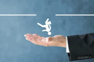 Stick figure falling through a hole in a line and an outstretched hand catching