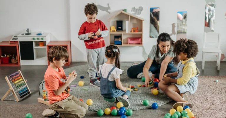 Teacher on floor with children